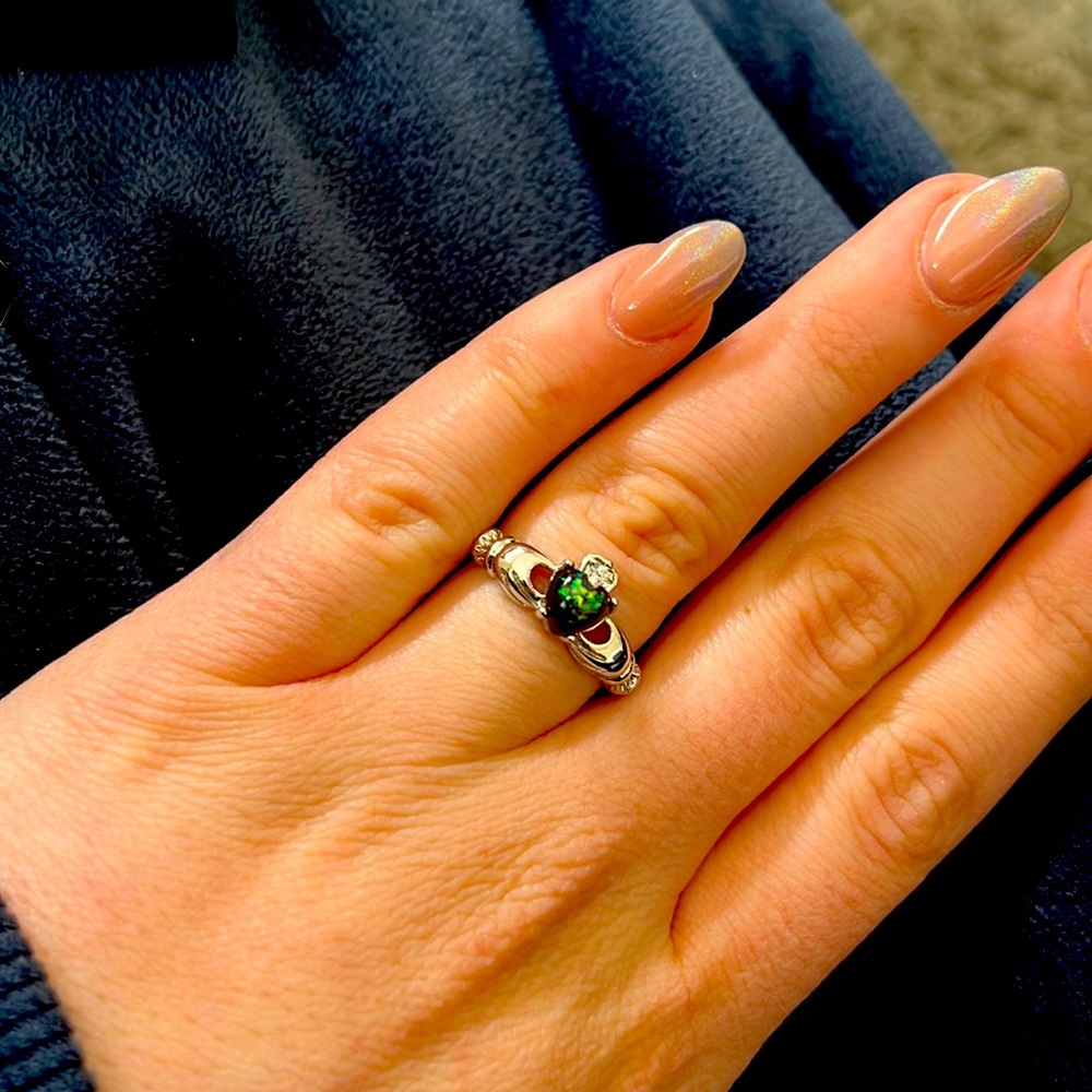 Claddagh ring with green center stone, CZ diamond for crown